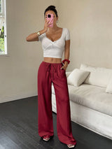 Flirla Women's Casual Solid Color Textured Fabric Knotted Waist Slant Pocket Wide Leg Pants Fall Cloth