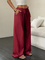 Flirla Women's Casual Solid Color Textured Fabric Knotted Waist Slant Pocket Wide Leg Pants Fall Cloth